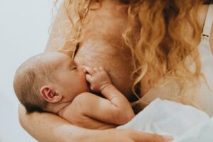 Baby contentedly feeding, emphasizing the essential connection and nutritional advantages