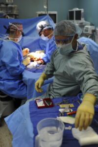Surgical team performing a c-section in an operating room