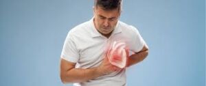 Man in white shirt experiencing chest pain, 