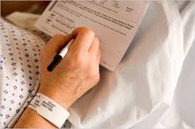 Patient signing a consent form