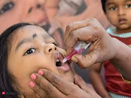Child receiving immunization from oral polio vaccine