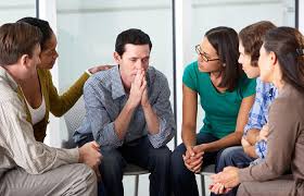 Man with Post-Traumatic Stress Disorder receiving moral support from support group
