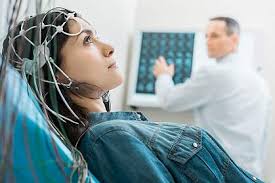 Woman undergoing EEG test for diagnosis.