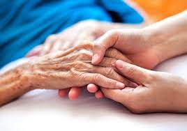 Caregiver offering support to elderly person - Providing comfort and care