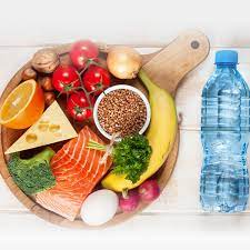 Nutrient-Rich Plate: A diverse assortment of nutritious food displayed on a plate, accompanied by a bottle of water, promoting the essence of Nutrition and Hydration Week