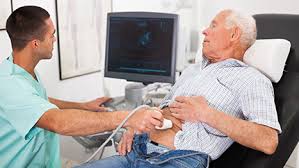 Elderly man receiving an abdominal ultrasound for abdominal pain
