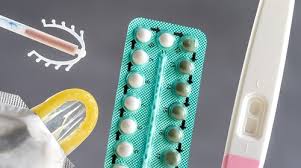 Assorted contraceptive devices including condoms, birth control pills, intrauterine devices (IUDs), and contraceptive implants that can be used during the postpartum period