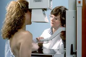 woman undergoing mammogram screening