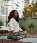 Woman practicing stress relief techniques through meditation