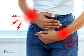 Woman experiencing pain holding abdomen related to the menstruation cycle