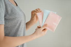 Person holding assorted menstrual pads