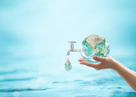 Water day conservation concept: Person holding a globe with a pipe dripping water into a body of water.