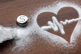 Heart-shaped arrangement of salt on a tabletop