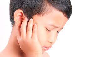 Child holding painful ear - Signs of Ear ache, Seek Care