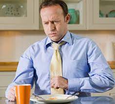 heartburn Symptoms - Person Experiencing Abdominal Discomfort