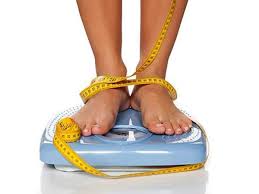 starvation diet: Person standing on a scale with feet tied together by a measuring tape - Illustration of unhealthy weight loss practices