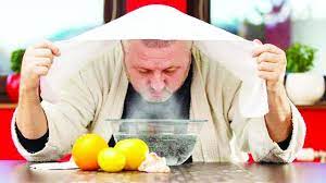 A man inhaling steam for hay fever relief or respiratory comfort.