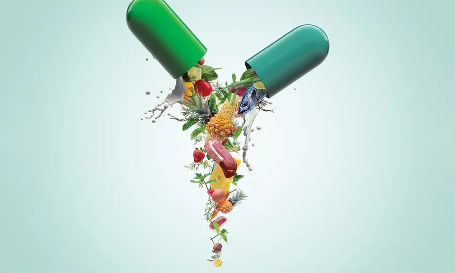 Split capsule pouring out - highlighting the contents of the supplement for enhanced health. Assorted fruits - representing natural sources of nutrients found in supplements.