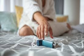 Person reaching for an inhaler - Asthma Day awareness