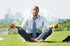 Man meditating in the park. Embrace tranquility and mental refreshment surrounded by the soothing sights and sounds of nature.