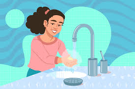 Girl washing her hands in a sink