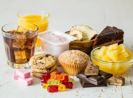 Processed food assortment - A group of processed food items, highlighting the variety of unhealthy options often consumed in modern diets.