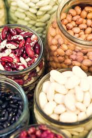 Assorted legumes including beans, lentils, and chickpeas, ideal for managing diabetes due to their high fiber and protein content, which helps stabilize blood sugar levels.