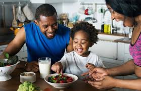 Parents encouraging their child to eat - Parenting