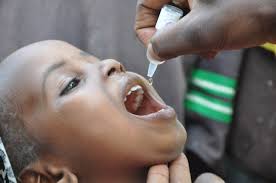 Child Receiving Oral Polio Vaccines: Essential Immunization for Disease Protection