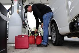 Safety first: Individual filling up fuel tanks ahead of the storm