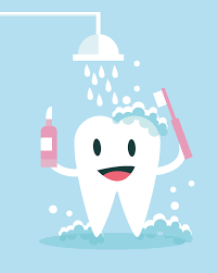 Tooth getting cleaned with toothpaste and toothbrush for oral hygiene.