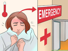 A shivering individual stands at the entrance of the emergency room, seeking urgent care for a fever.