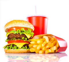 Fast food combo featuring a burger, fries, and soda, showcasing the tempting yet unhealthy calories and their implications on overall well-being.