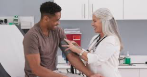 Healthcare professional assessing blood pressure for preventive care.