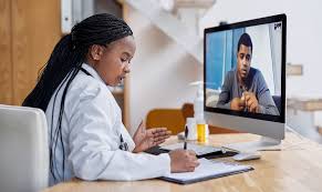 Telemedicine appointment: Doctor writing prescription for patient remotely