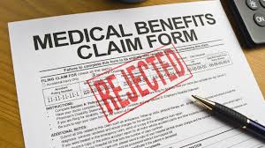 Illustration of a health insurance claim form marked as rejected, emphasizing the importance of understanding denial reasons and the appeal process.