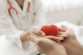 Healthcare professional offering heart support to patient