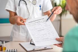 Nurse providing instructions to a patient, using a document as a guide, highlighting the crucial role of clear communication 