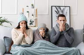 Family sitting on the sofa, finding comfort during cold relief