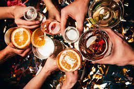 Alcohol consumption: People in a Group Toasting Together.