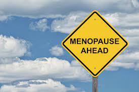 Caution sign with the word 'menopause': A visual representation emphasizing the need for awareness and understanding during this natural life transition.