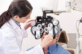 Ophthalmologist using advanced eye machine during an eye examination