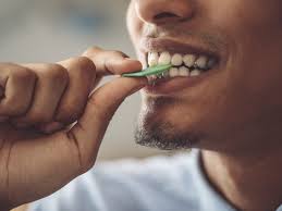 Person enjoying chewing gum with a smile