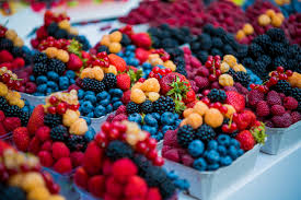 An image of a variety of colorful fruits, vegetables, and beverages rich in polyphenols, emphasizing their antioxidant and health-promoting properties