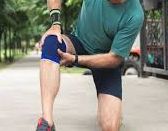 Man performing knee stretches, highlighting the importance of flexibility exercises in managing and preventing chronic pain.