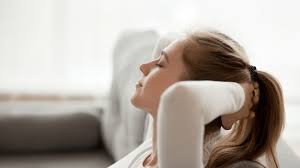 Relaxed woman finding peace and relief from stress.