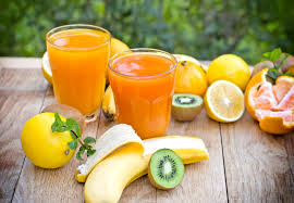 Colorful assortment of fruits highlighting kiwi, banana, and orange's Vitamin C content.
