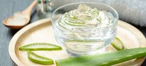 cup filled with fresh aloe vera on a plate