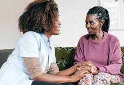 Caregiver provider offering compassionate support to an elderly woman.