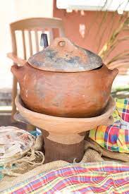 Creole-season-cooking-on-coal-pot: A traditional Creole cooking scene with a pot on a coal pot, reflecting the essence of Creole season culinary practices.